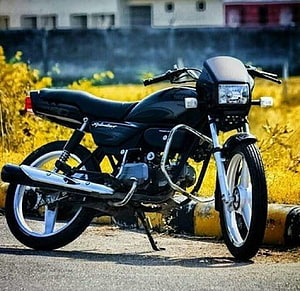 Black Hero Splendor Custom Motorcycle Parked on Street with Yellow Grass Background HD wallpaper